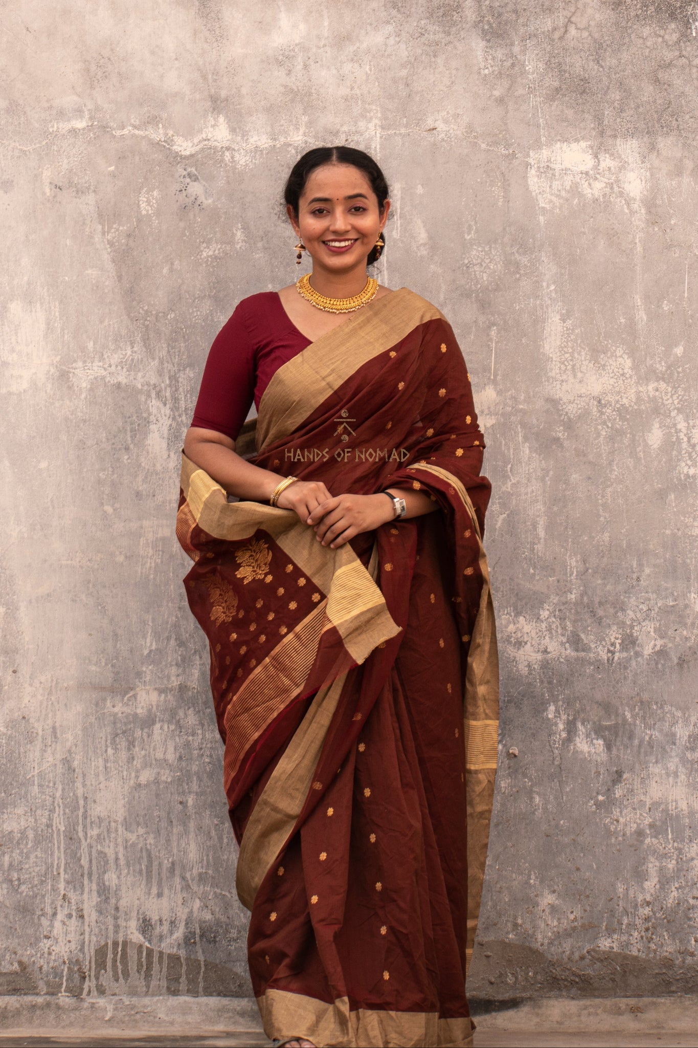 Woman wearing a Maroon Cotton Silk Chanderi Saree.