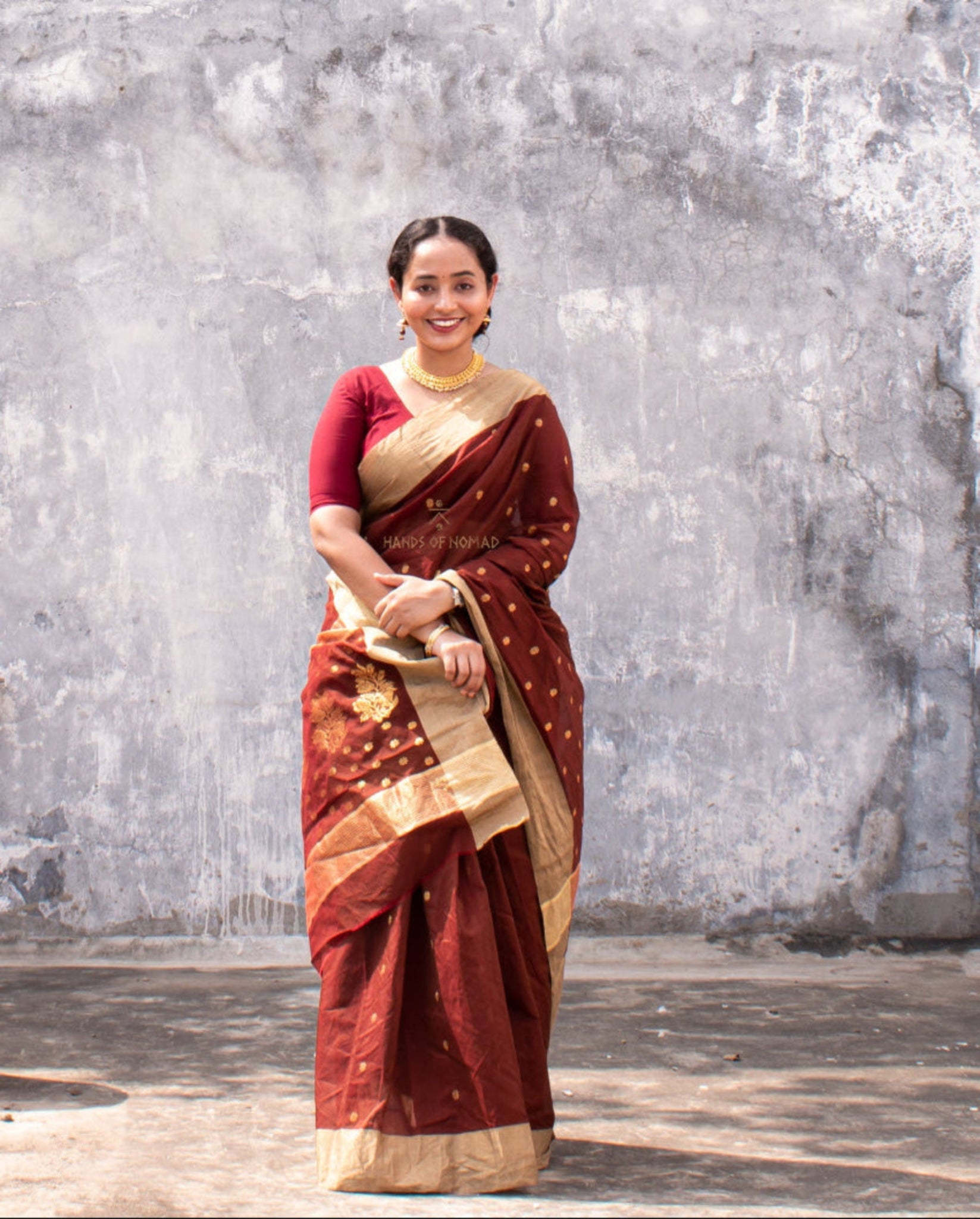 Woman wearing a Maroon Cotton Silk Chanderi Saree.