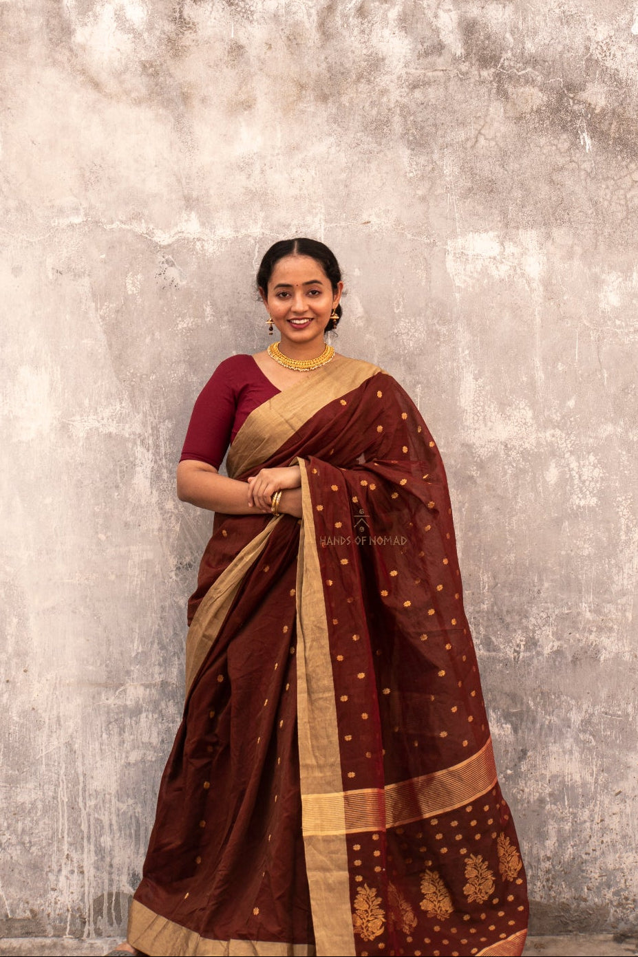 Woman wearing a Maroon Cotton Silk Chanderi Saree.