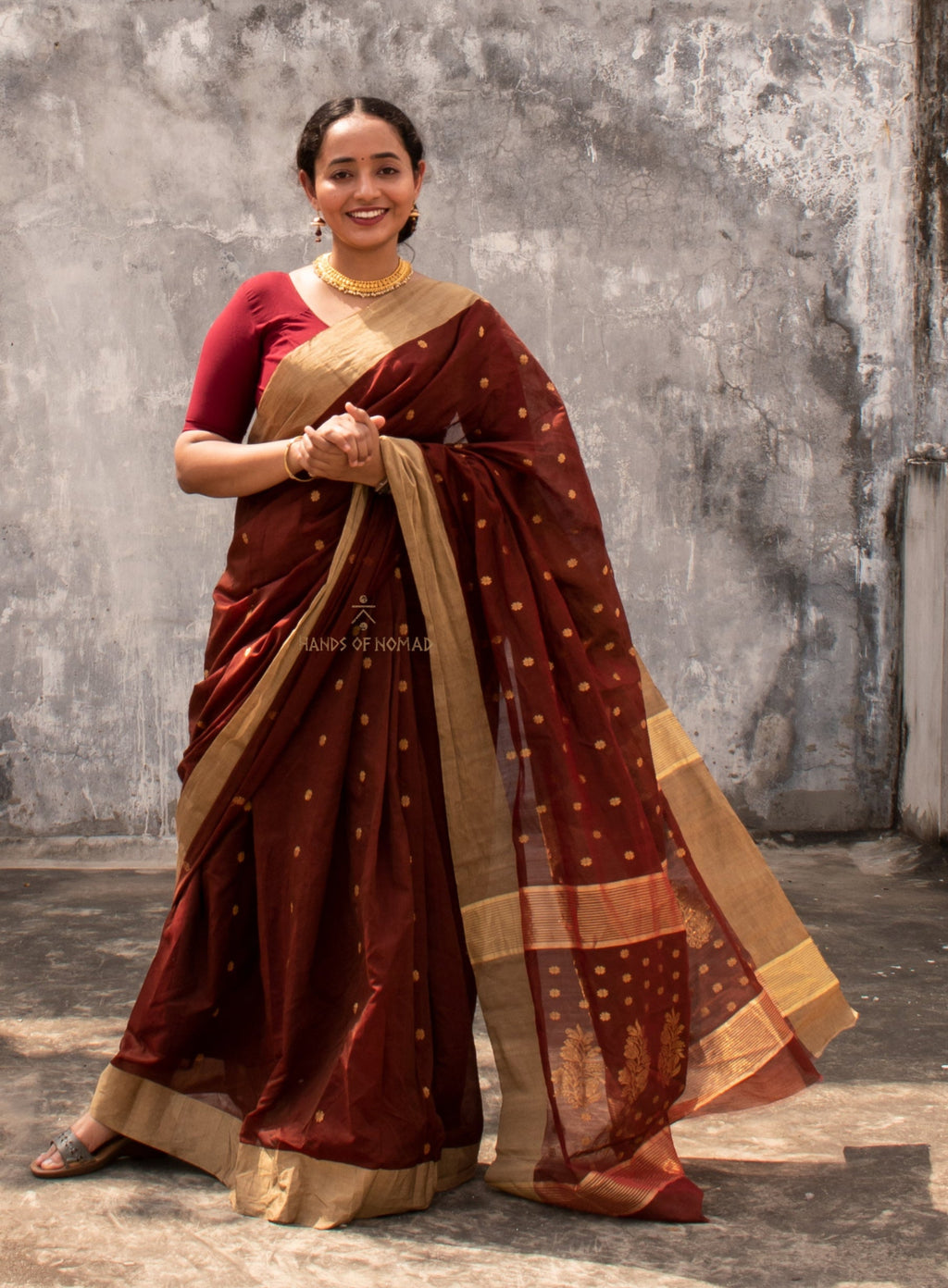 Woman wearing a Maroon Cotton Silk Chanderi Saree.