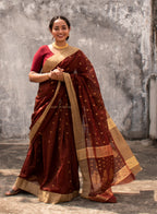 Woman wearing a Maroon Cotton Silk Chanderi Saree.
