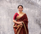 Woman wearing a Maroon Cotton Silk Chanderi Saree.
