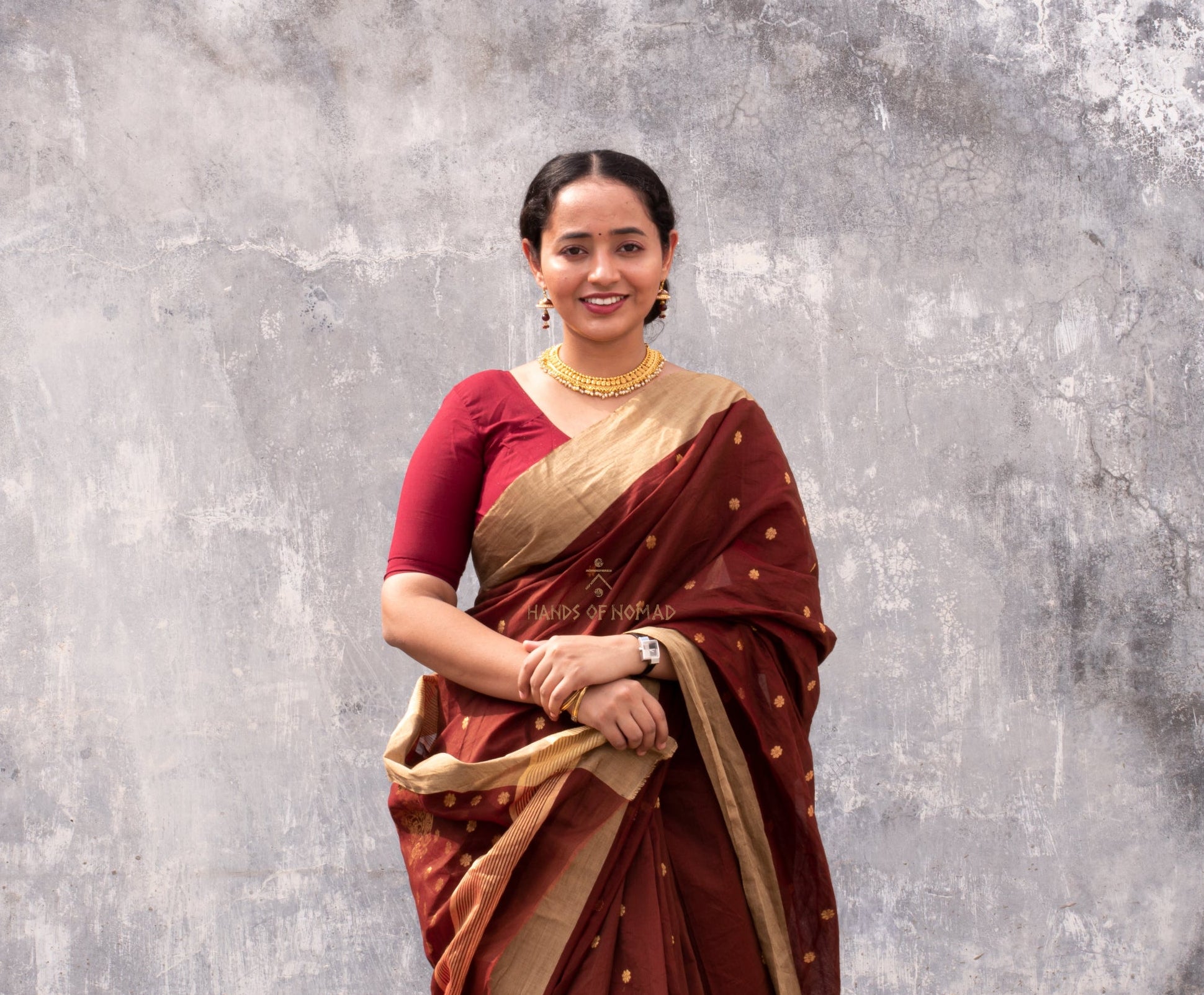 Woman wearing a Maroon Cotton Silk Chanderi Saree.