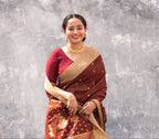 Woman wearing a Maroon Cotton Silk Chanderi Saree.