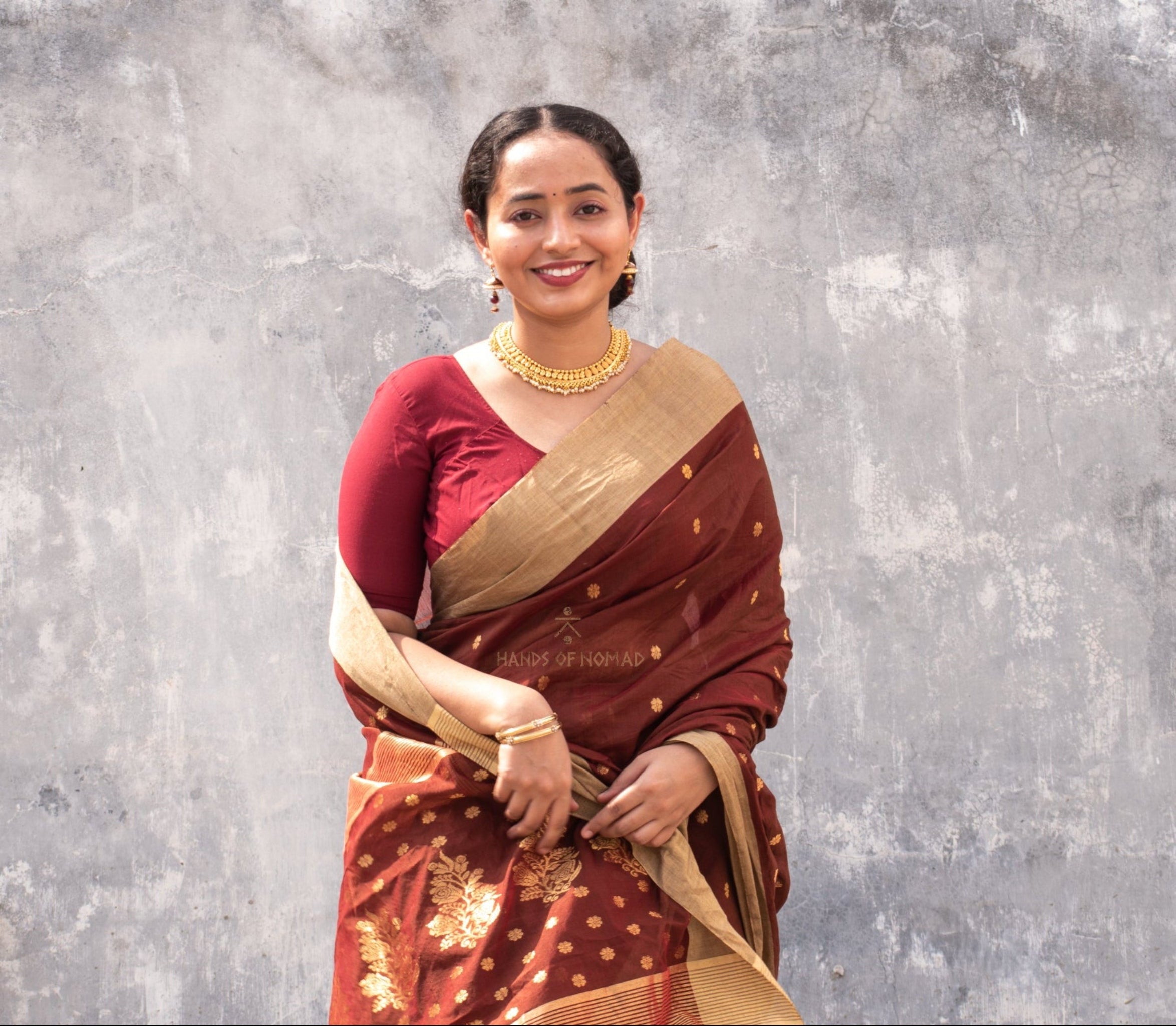 Woman wearing a Maroon Cotton Silk Chanderi Saree.