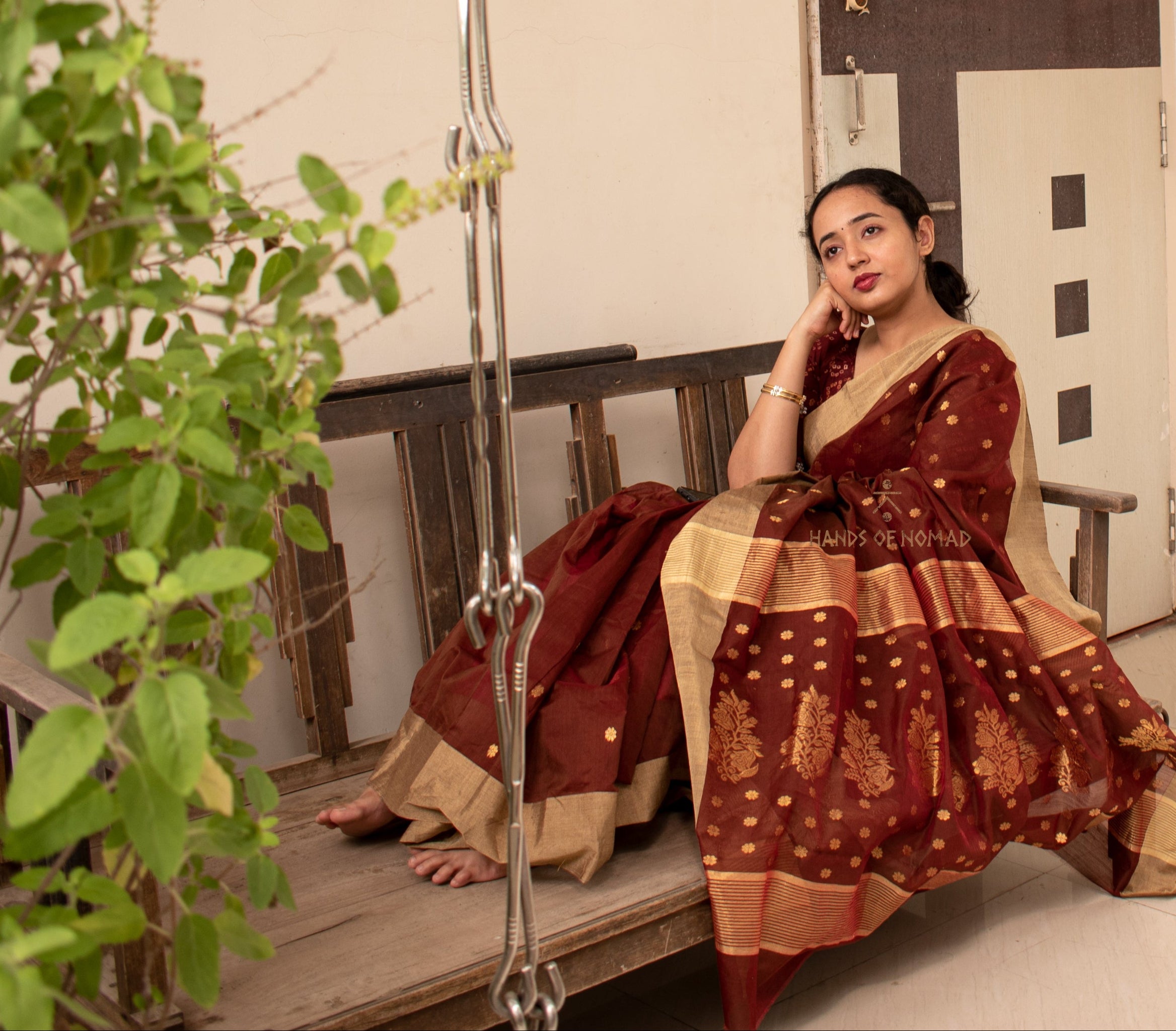 Woman wearing a Maroon Cotton Silk Chanderi Saree.