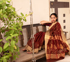 Woman wearing a Maroon Cotton Silk Chanderi Saree.