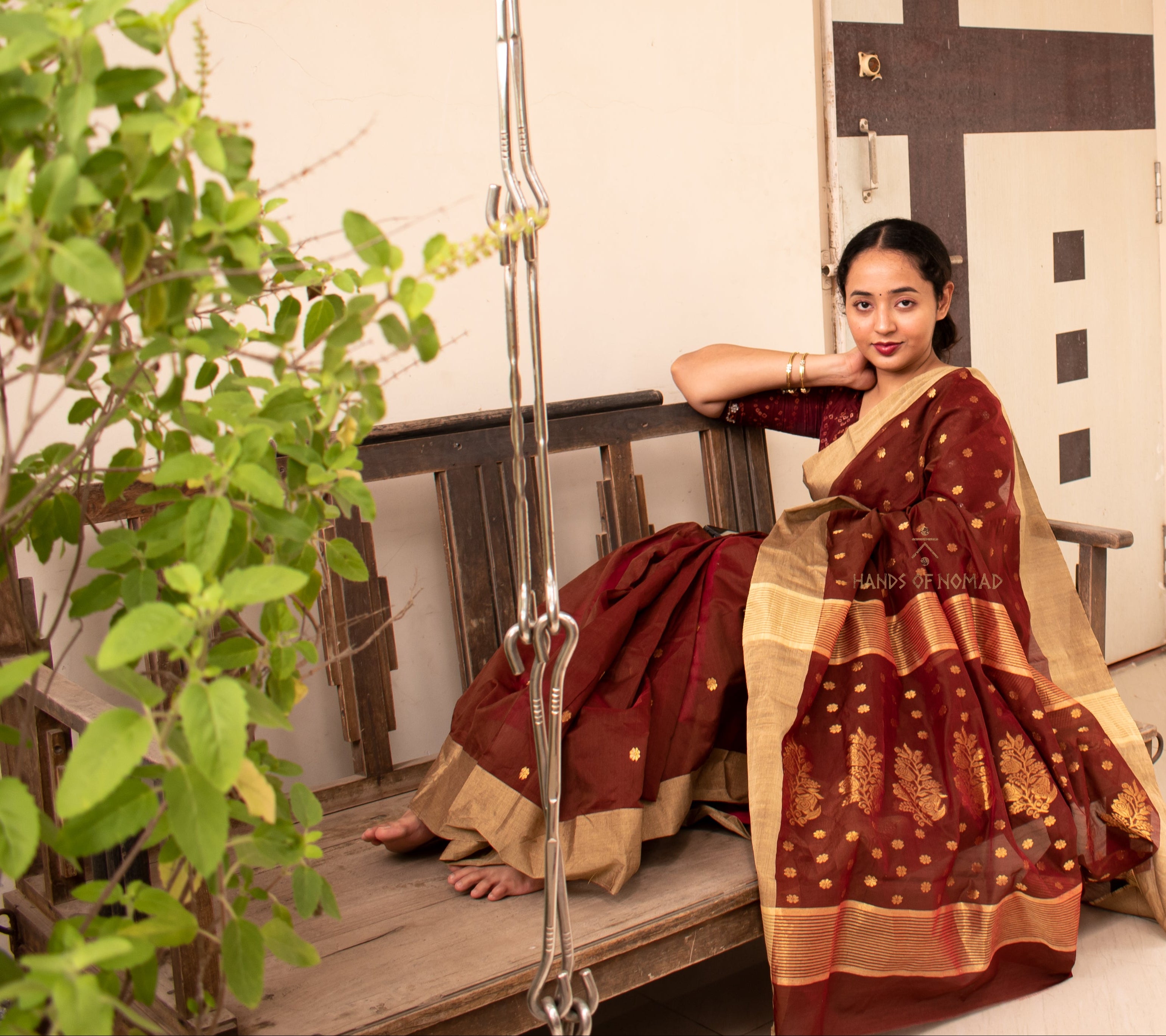 Woman wearing a Maroon Cotton Silk Chanderi Saree.
