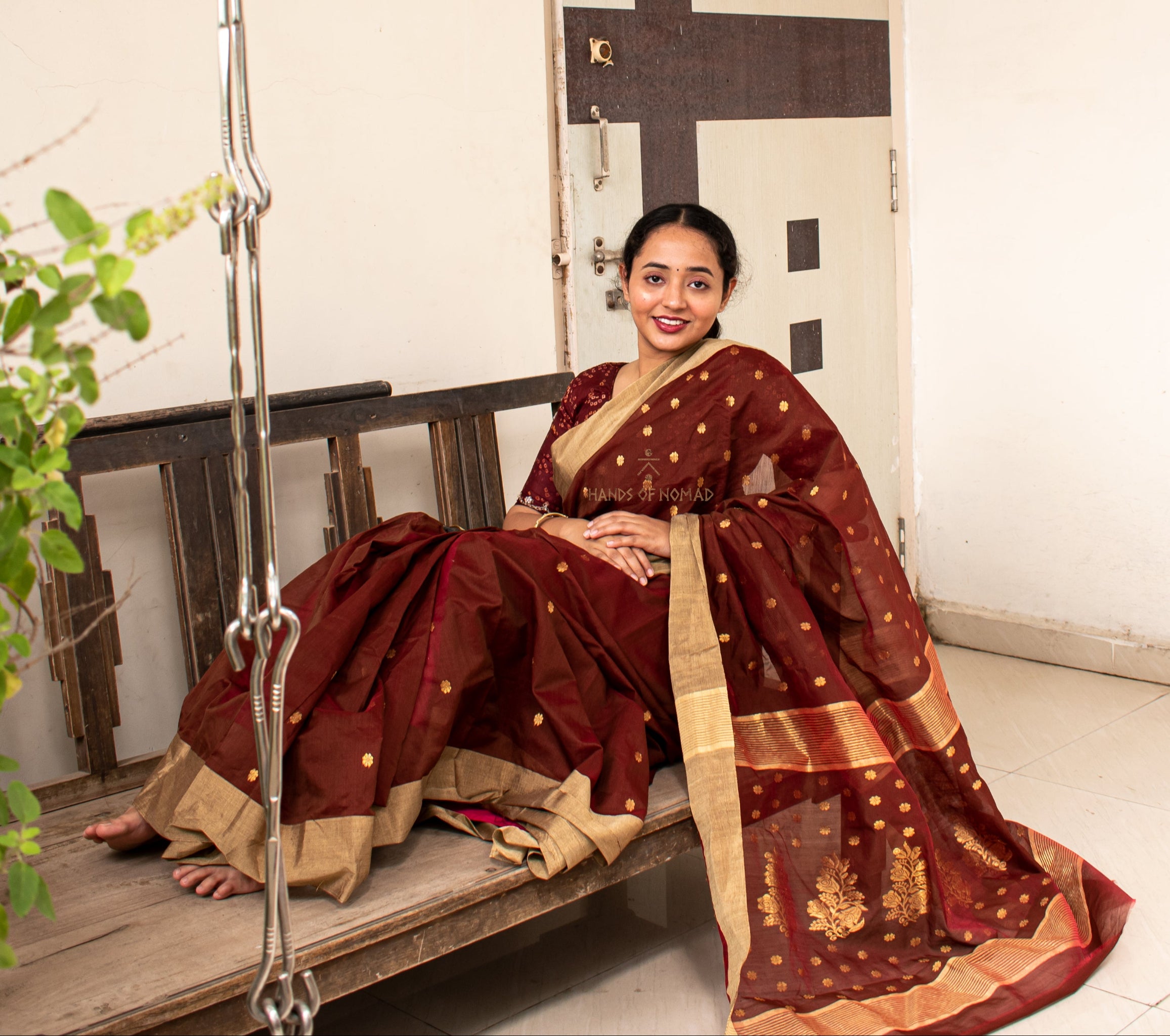 Woman wearing a Maroon Cotton Silk Chanderi Saree.